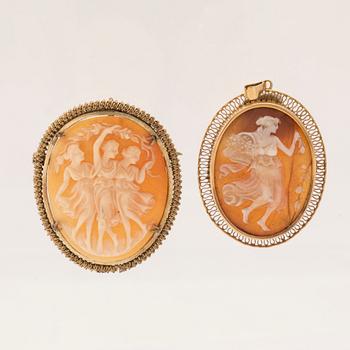 A pair of shell cameo pendants.