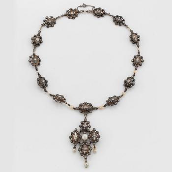 A silver necklace/pendant set with rose-cut diamonds and pearls.