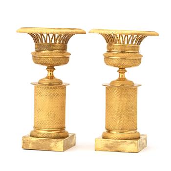 A pair of French Empire early 19th century gilt bronze urns.