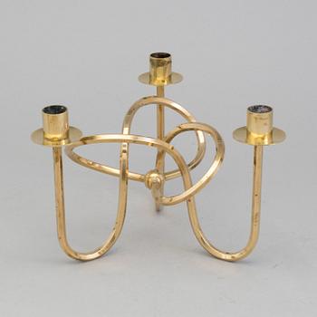 A brass candleholder "The knot of Friendship"design Josef Frank for Svenskt Tenn, Stockholm.