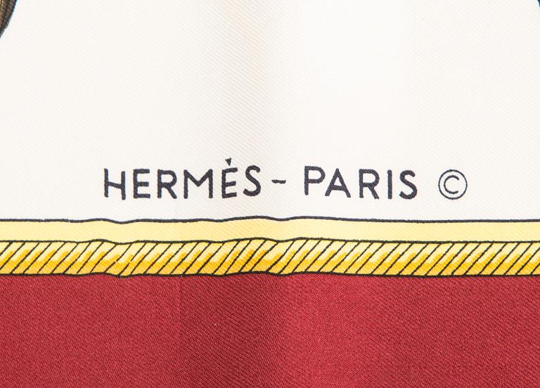 Hermès, a 'Les Voitures à Transformation' silk scarf.