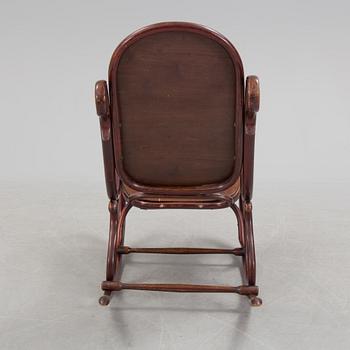 A stained rocking chair by Thonet, about 1900.
