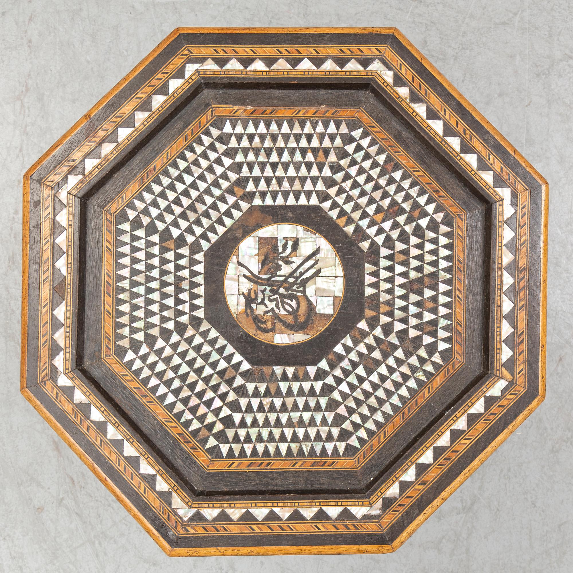 A mother of pearl and wood small table, 20th century.