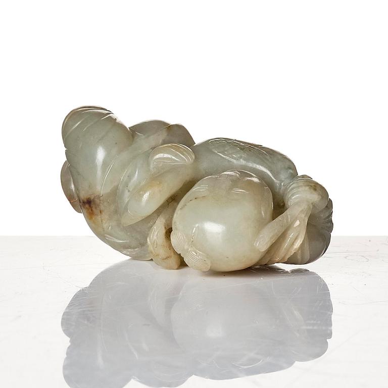 Two archers rings and two nephrite carvings.