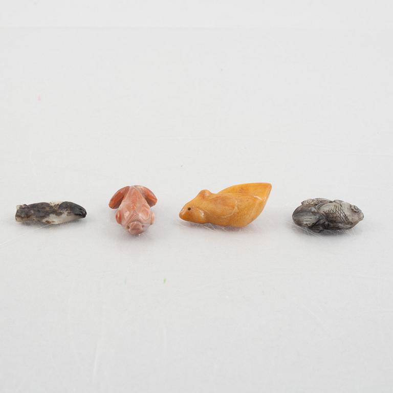 A group of eight Chinese stone charms / pendants, 20th century.