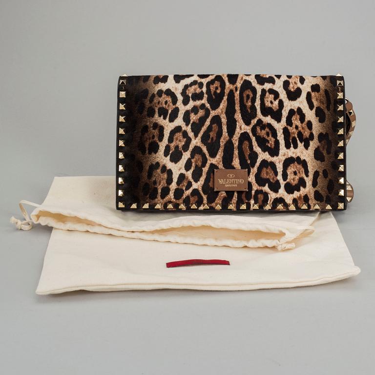 A ponyhair clutch with studs by Valentino.