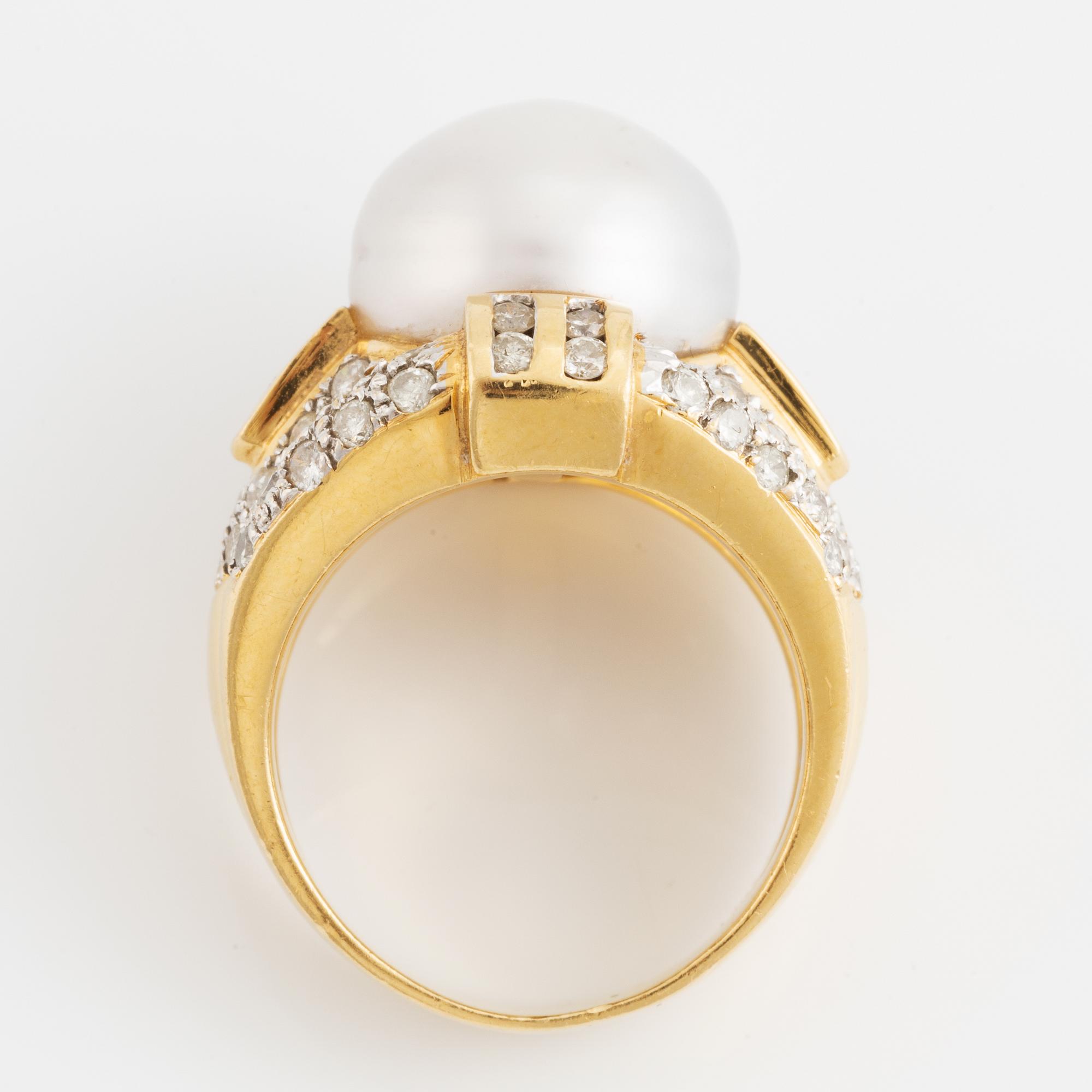 Cultured pearl and brilliant cut diamond ring.