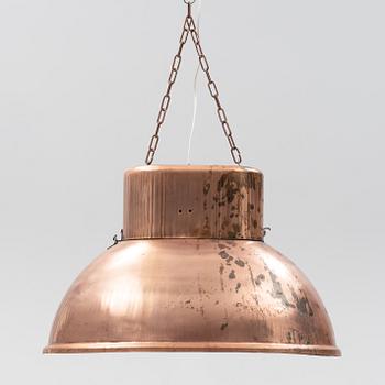 A contemporary copper ceiling lamp.