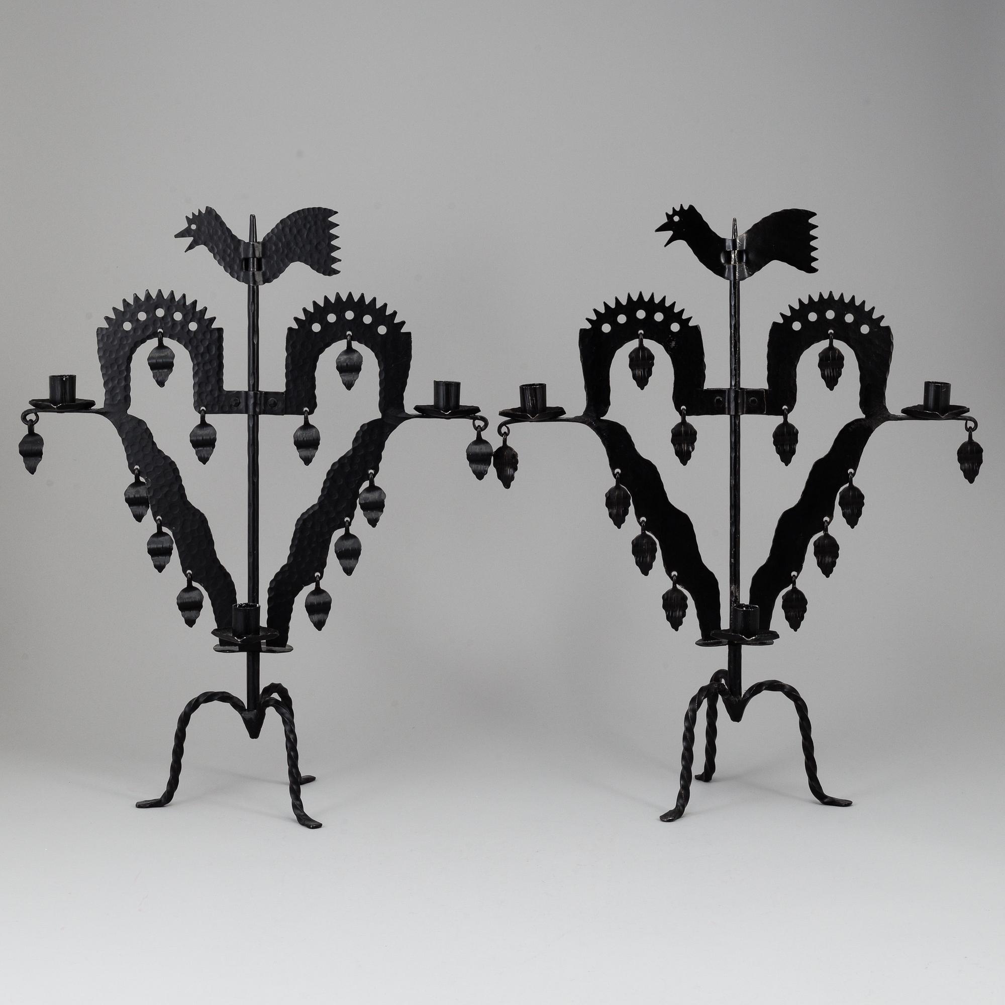KANDELABRAR , 2 st smide, "Tuppljusstake" Design Gustaf Ancarkrona, Käck & Hedbys, Leksand.