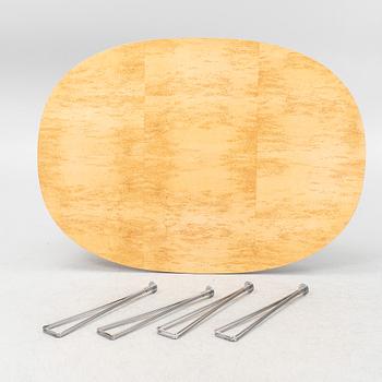 A 'Super elliptical' dining table by Bruno Mathsson & Piet Hein for Fritz Hansen.