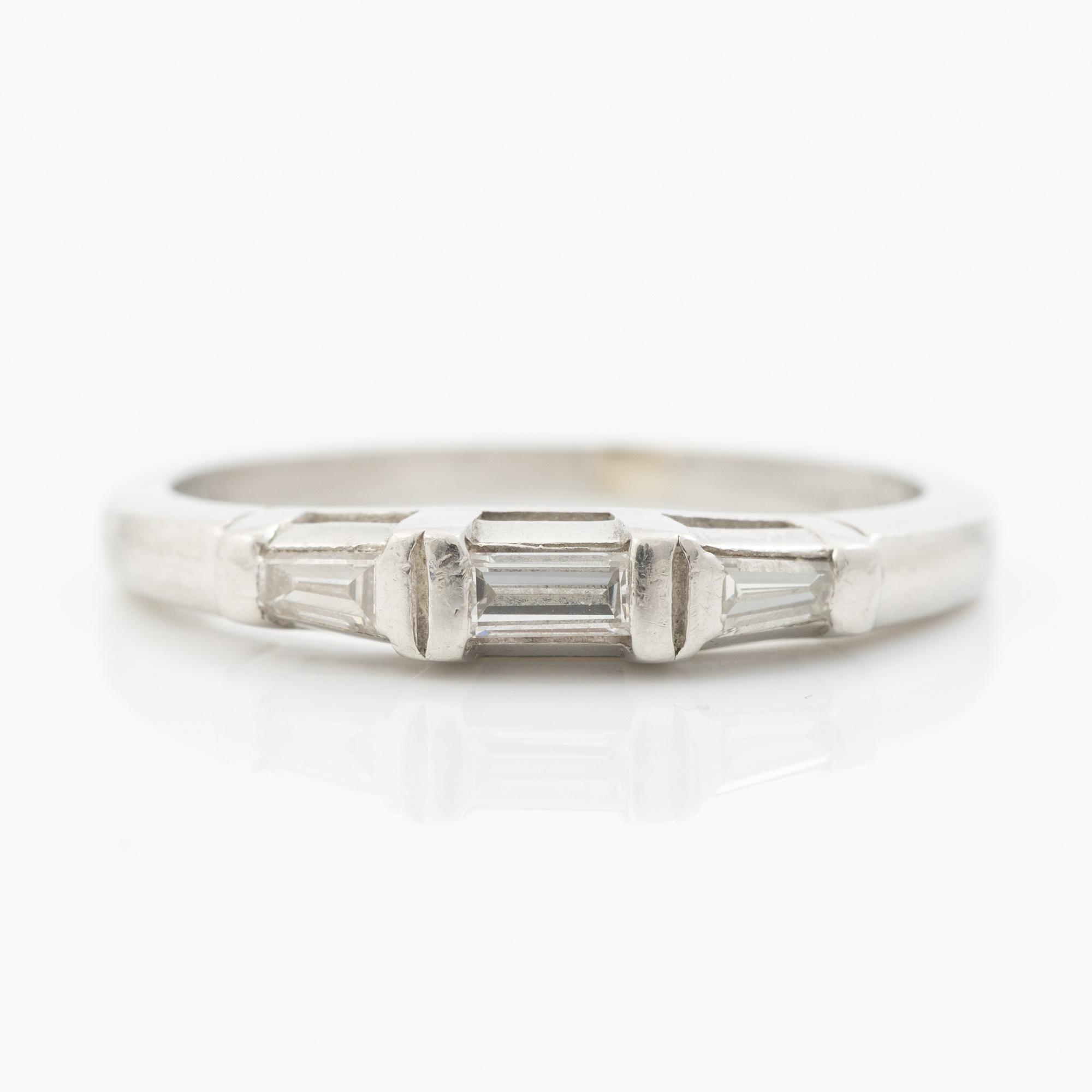 Platinum ring with baguette-cut diamonds.