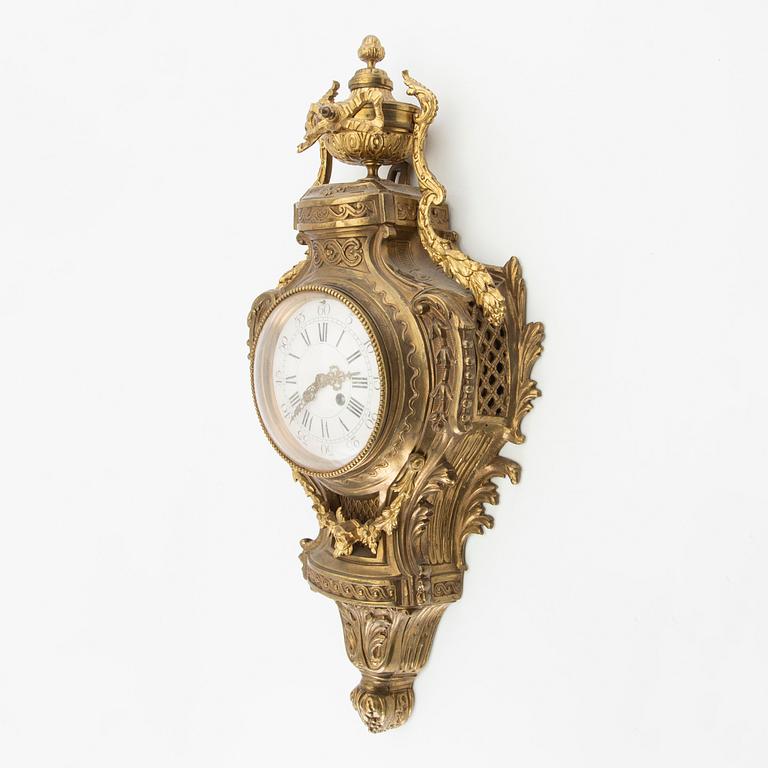 Wall clock in Louis XV style, circa 1900.