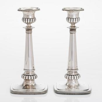 A pair of silver candlesticks, maker's mark of A. Homan, active in Amsterdam, 1817 – 1842.