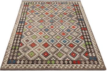 A Kilim carpet, c. 298 x 196 cm.