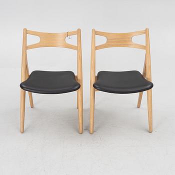 Hans J Wegner, a pair of chairs, model CH 29 "The Savbuk Chair", Carl Hansen.