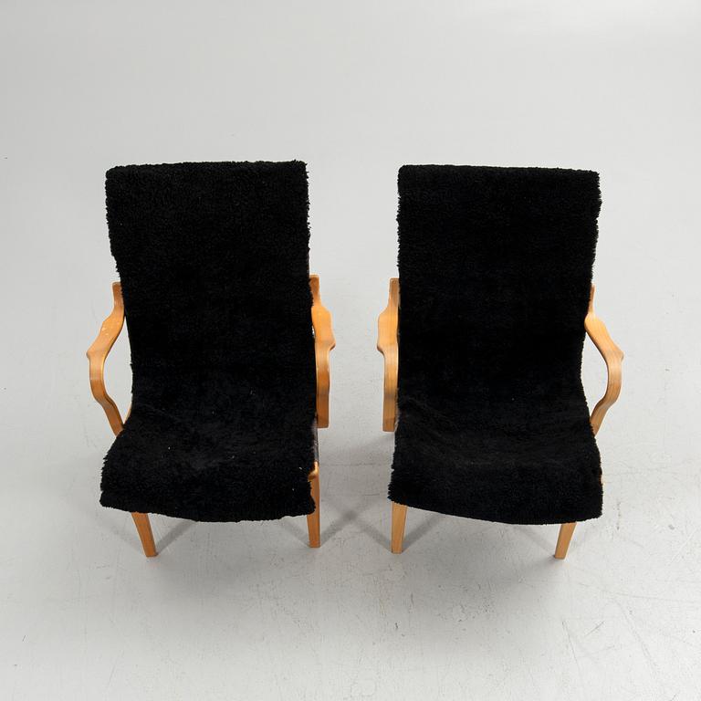 Bruno Mathsson, armchairs, a pair, "Eva", Bruno Mathsson International, Värnamo, second half of the 20th century.