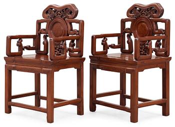 1821. A pair of hardwood armchairs, Qing dynasty.