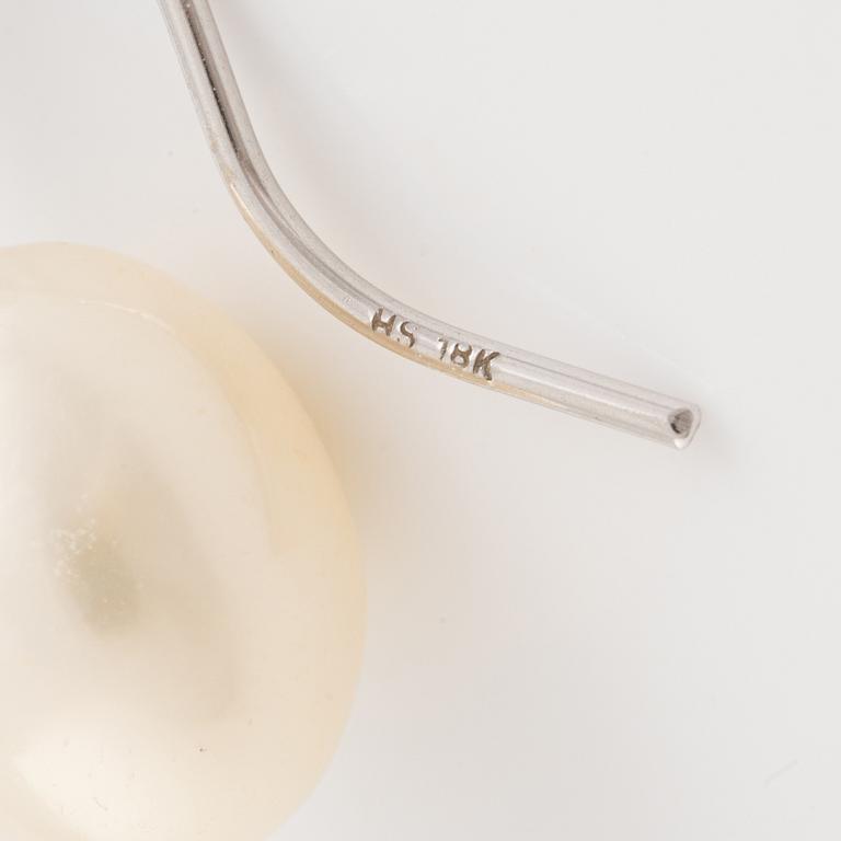 A pair of white gold earrings with cultured pearls.