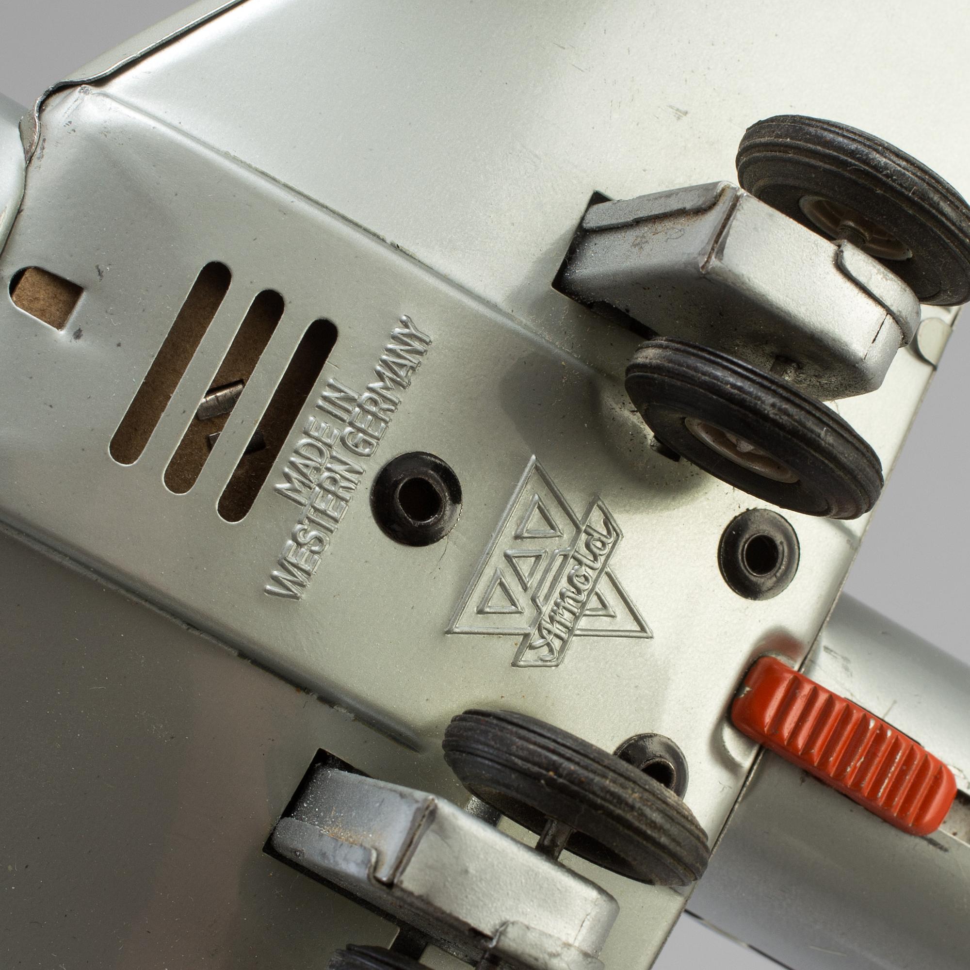 Two tinplate toy planes by Tomiyama and Arnold, Japan and Germany, 1960s.