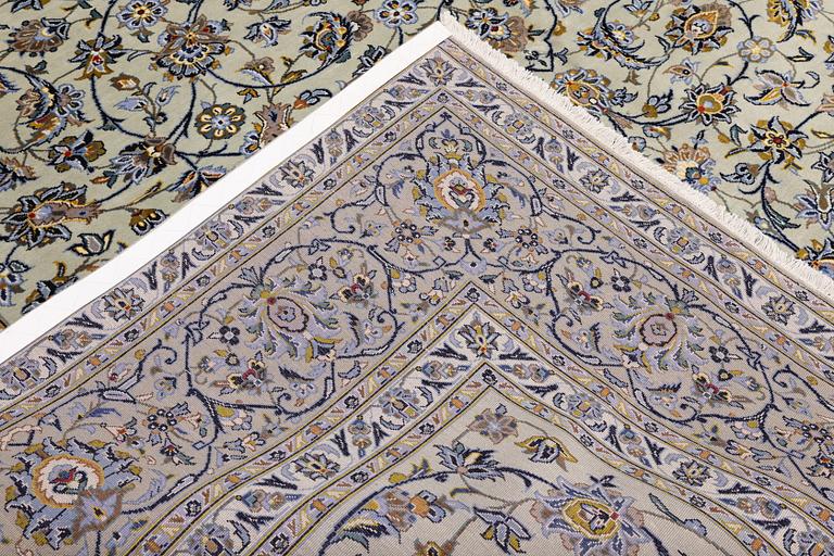 A Keshan carpet, signed, 397 x 302 cm.