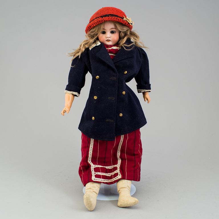 An Armand Marseille 3200 DEP Made in Germany bisque head doll.