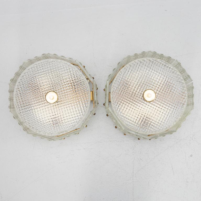 Carl Fagerlund, a pair of glass and brass ceiling lamps, Sweden, second half of the 20th century.