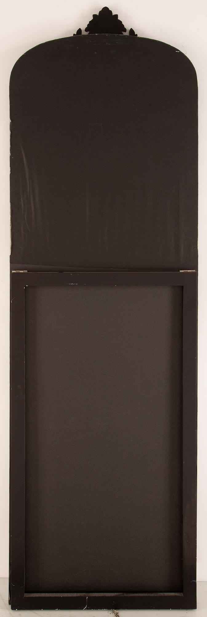 A contemporary floor mirror.