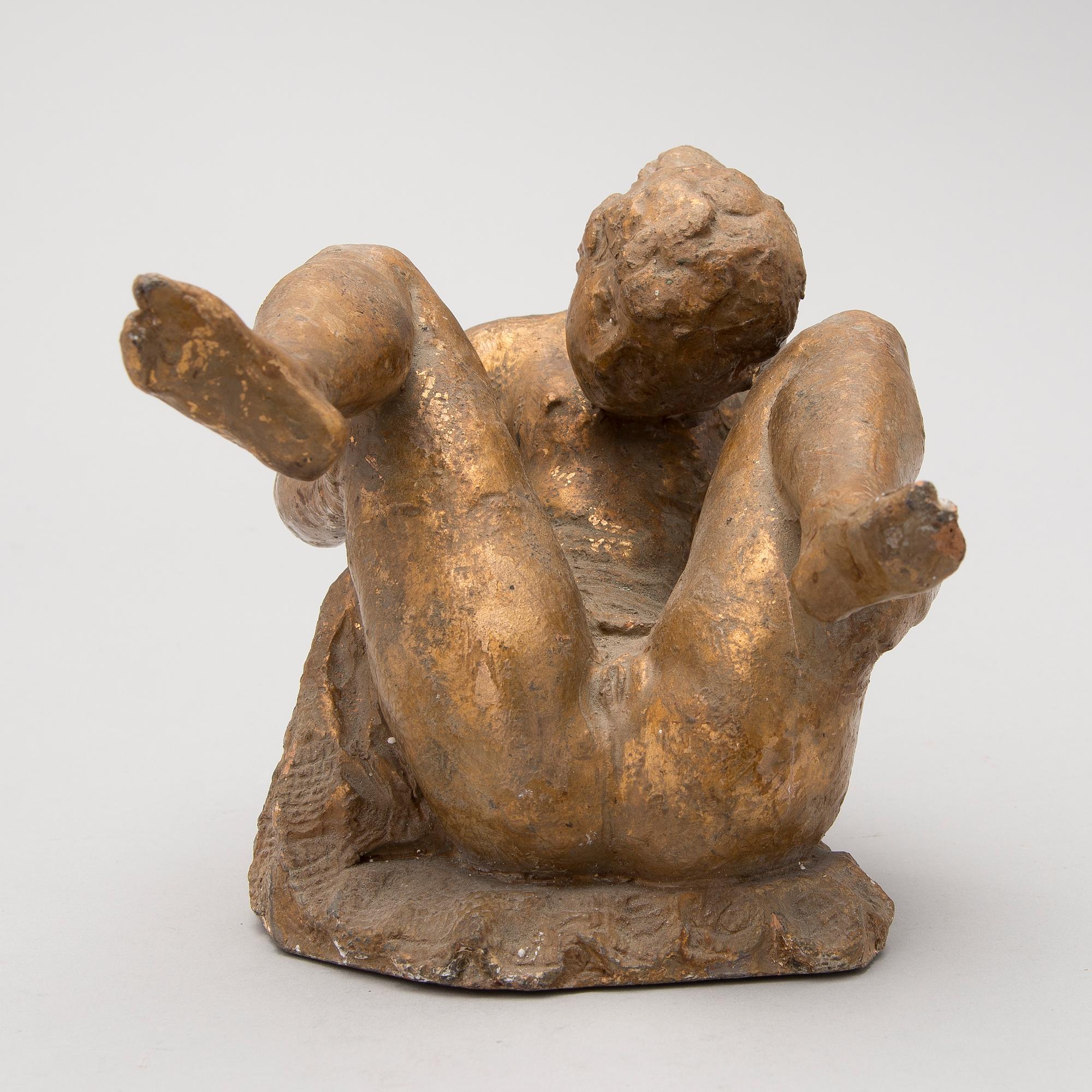 A gilt terracotta sculpture signed Matti Haupt.