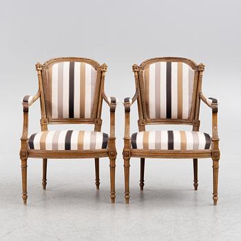 A pair of Louis XVI-style armchairs, late 19th century.