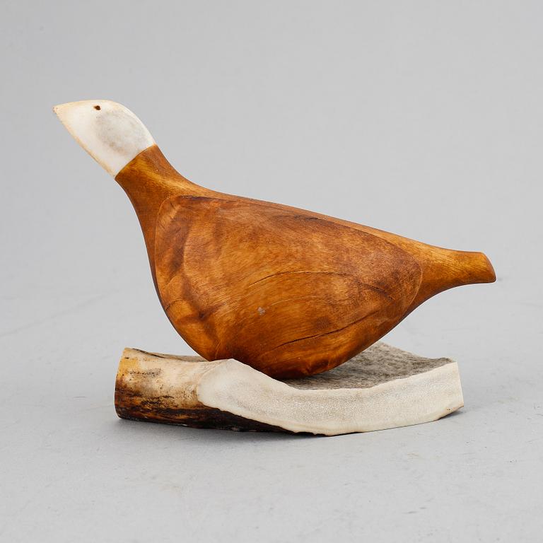 Lars Levi Sunna, a Sami reindeer horn and birch figurine of a grouse, signed LL Sunna.