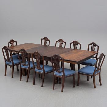 A 19th century dining table and a set of twelve chairs.