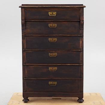 A chest of drawers, circa 1900.