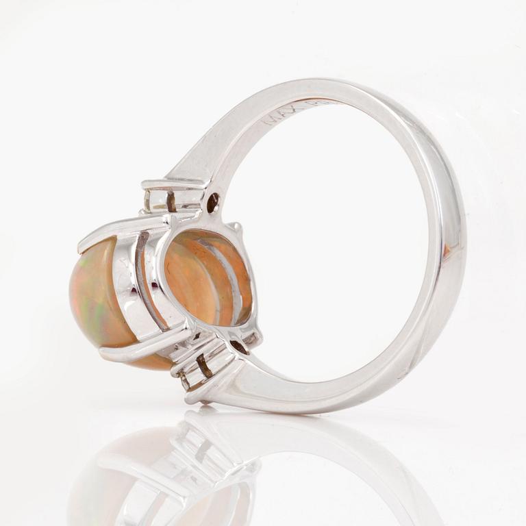 An opal and brilliant-cut diamond ring.