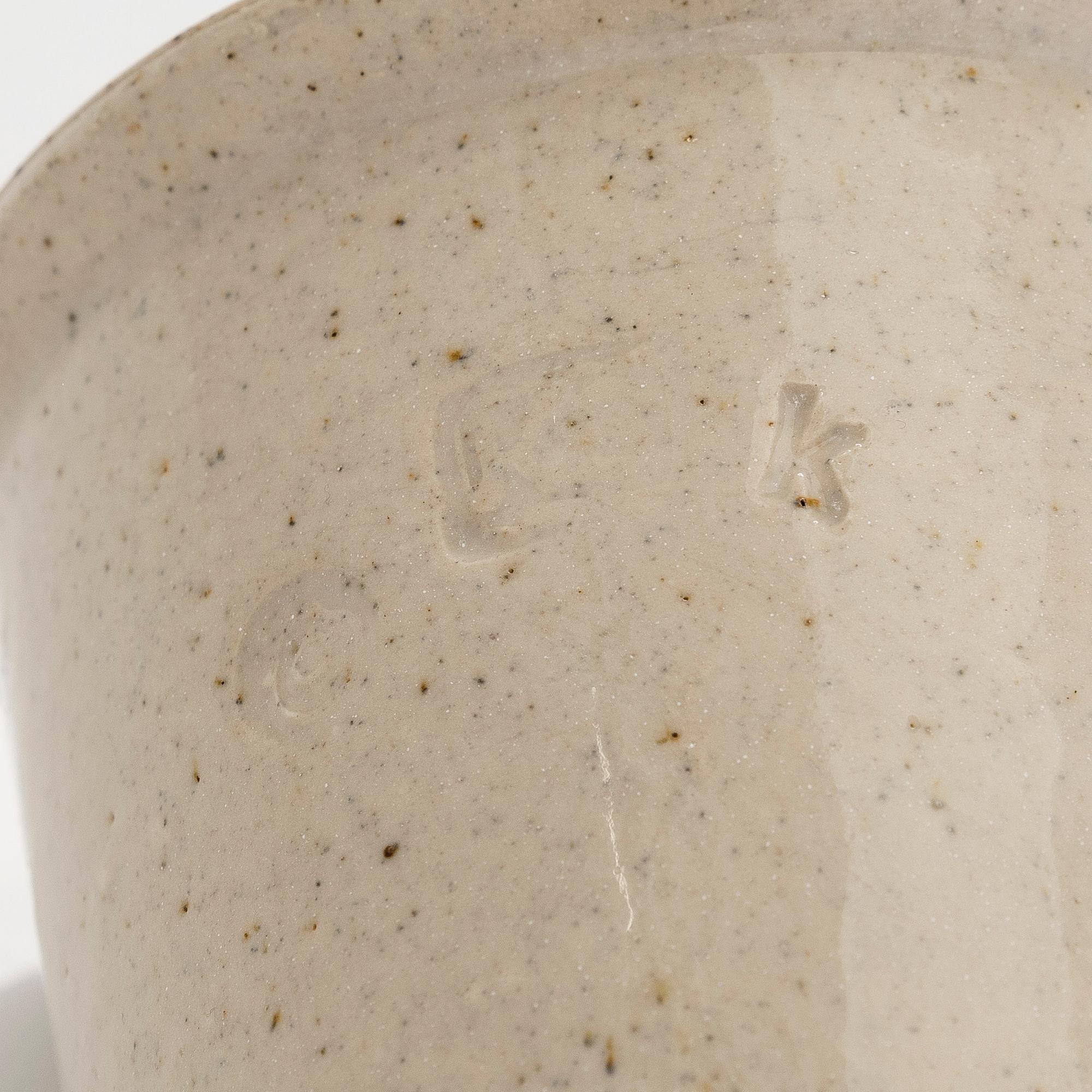 Kyllikki Salmenhaara, a stoneware tea strainer signed KS.