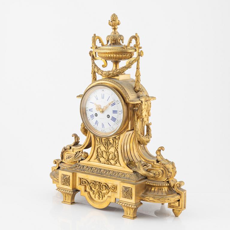 A Louis XVI-style gilt bronze mantel clock, 19th Century.