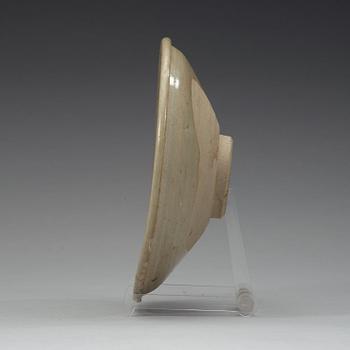 A carved celadon dish, Ming dynasty (1368-1644).