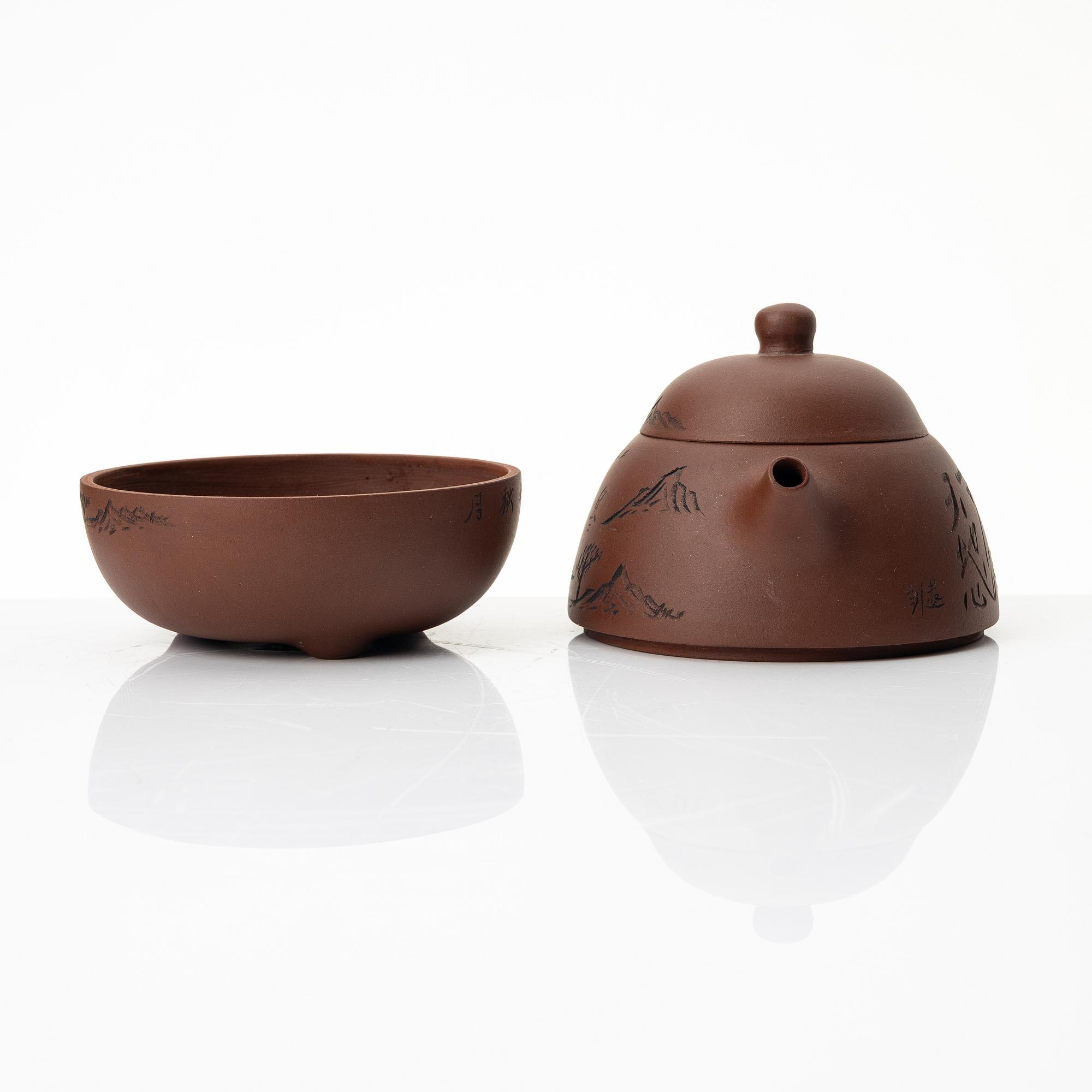 Wu Quan Xiang, A Chinese yixing teapot and a bowl with sieve and four cups, 1980s.