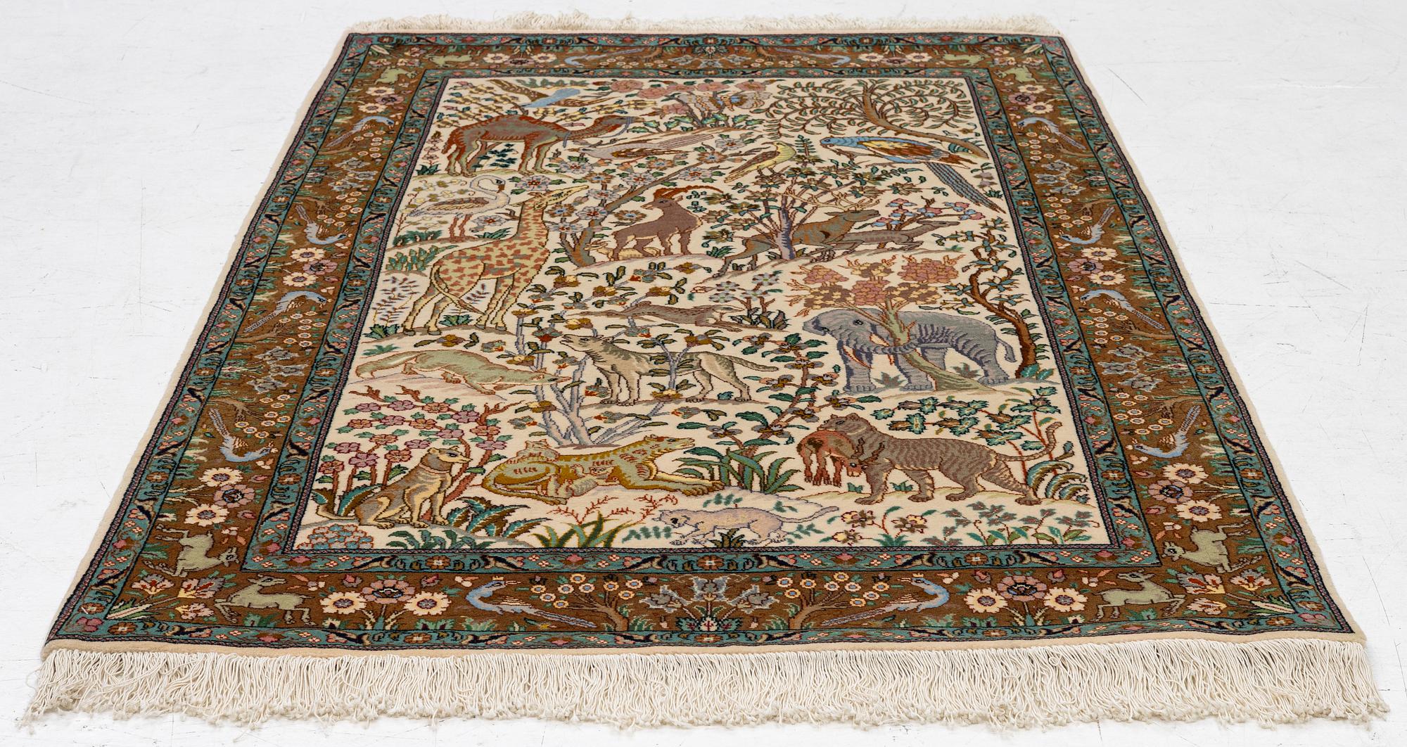 A Tabriz part silk rug, c. 145 x 100 cm.
