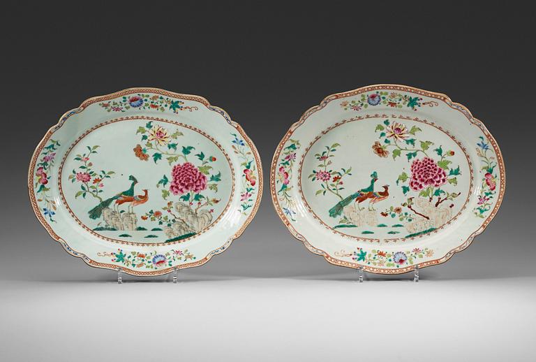 A pair of famille rose 'double peacock' serving dishes, Qing dynasty, Qianlong (1736-95).