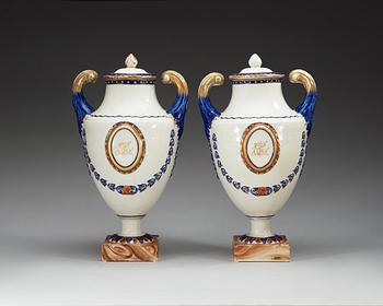 A pair of famille rose vases with covers, Qing dynasty, Qianlong (1736-95).