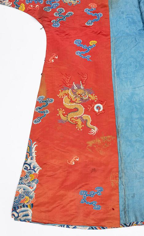 An embroidered red ground five clawed dragon 'female' formal robe, Qing dynasty, 19th century.