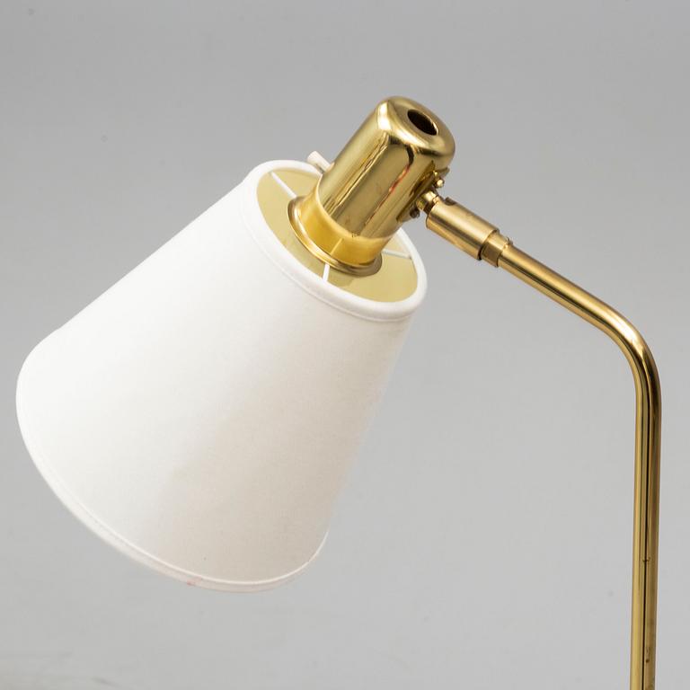 a brass and leather floor lamp from the second half of the 20th century.