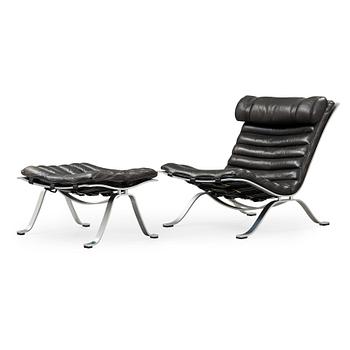 443. Arne Norell, an 'Ari' steel and black leather lounge chair with ottoman, Norell, Sweden.