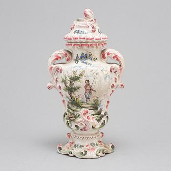 A Rococo faiance vase with cover, mid 18th century.