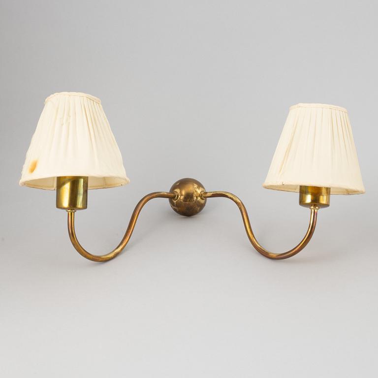 Three brass wall lamps, model 2335 and 2334, by Josef Frank, Firma Svenskt Tenn.