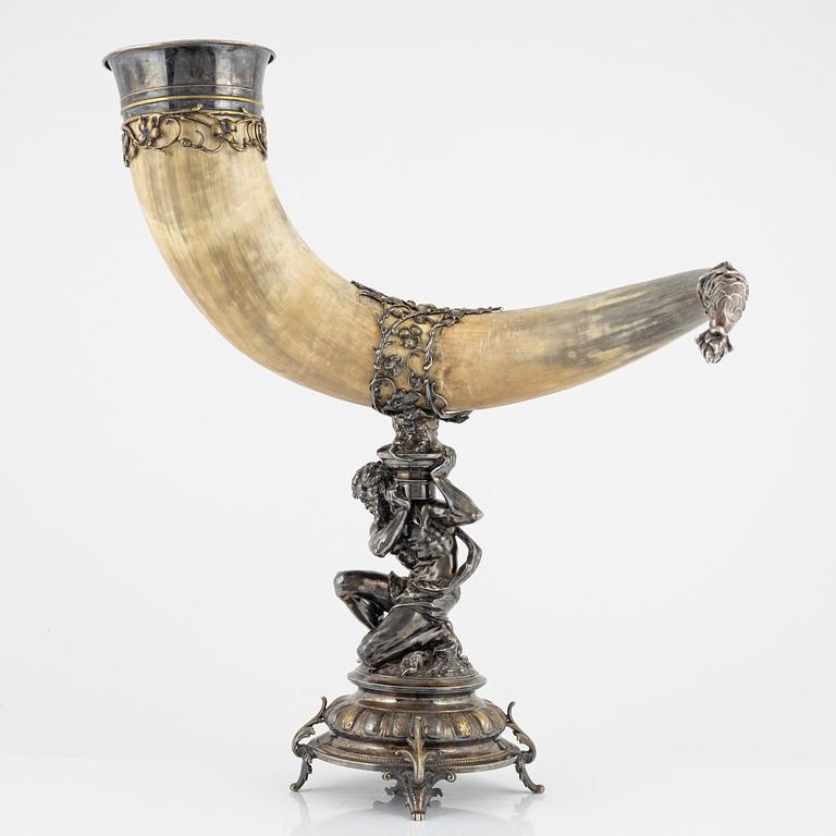 An early 20th century drinking horn with silver plated mount and base.