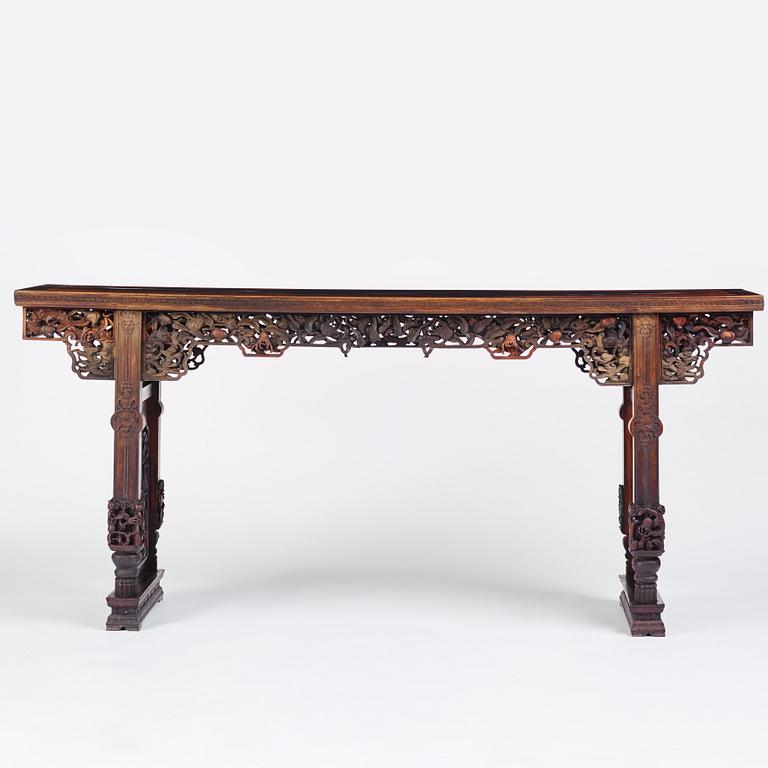 A massive zitan recessed-leg long table 'Jiaotousun Qiotouan', Qing dynasty, 19th century.