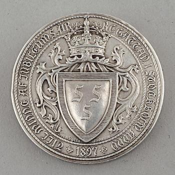 A silver medal and case, case from C G Hallberg in Stockholm 1899.