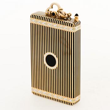 A Cartier Art Deco Vanity Case/Minaudière in 18K gold, black enamel and onyx.