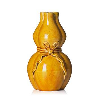1159. A yellow glazed triple spouted double gourd vase, Qing dynasty, 18th century.